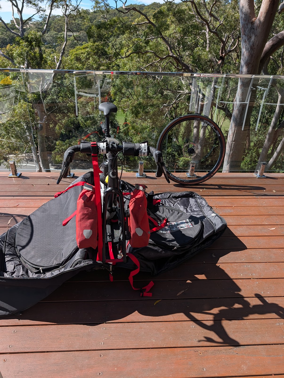 Road bike packed in Aerocomfort travel bag on deck, ready for Singapore Airlines flight, Sydney, April 2026