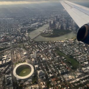 Brisbane CBD, river and the Gabba seen from a plane window on approach to Brisbane Airport