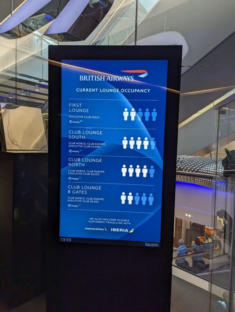 British Airways current lounge occupancy display board at Heathrow Terminal 5, showing First Lounge and Club Lounge North, South and B Gates capacity