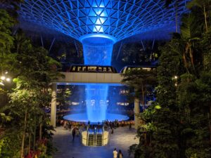 The Rain Vortex waterfall at Jewel Changi Airport Singapore lit up at night