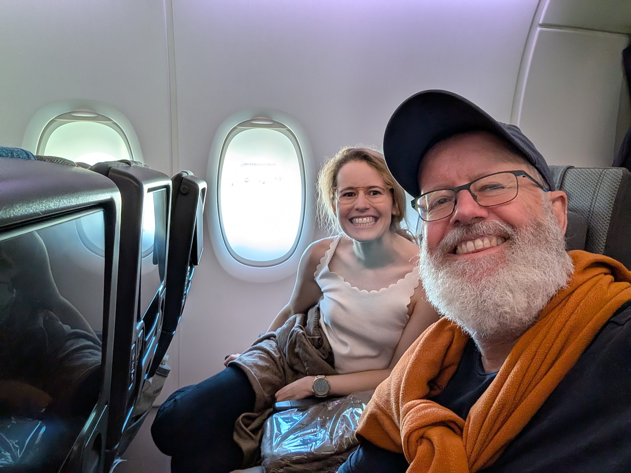 Drew and Annie in Singapore Airlines economy seats on A350-900, return leg Munich to Singapore, April 2026