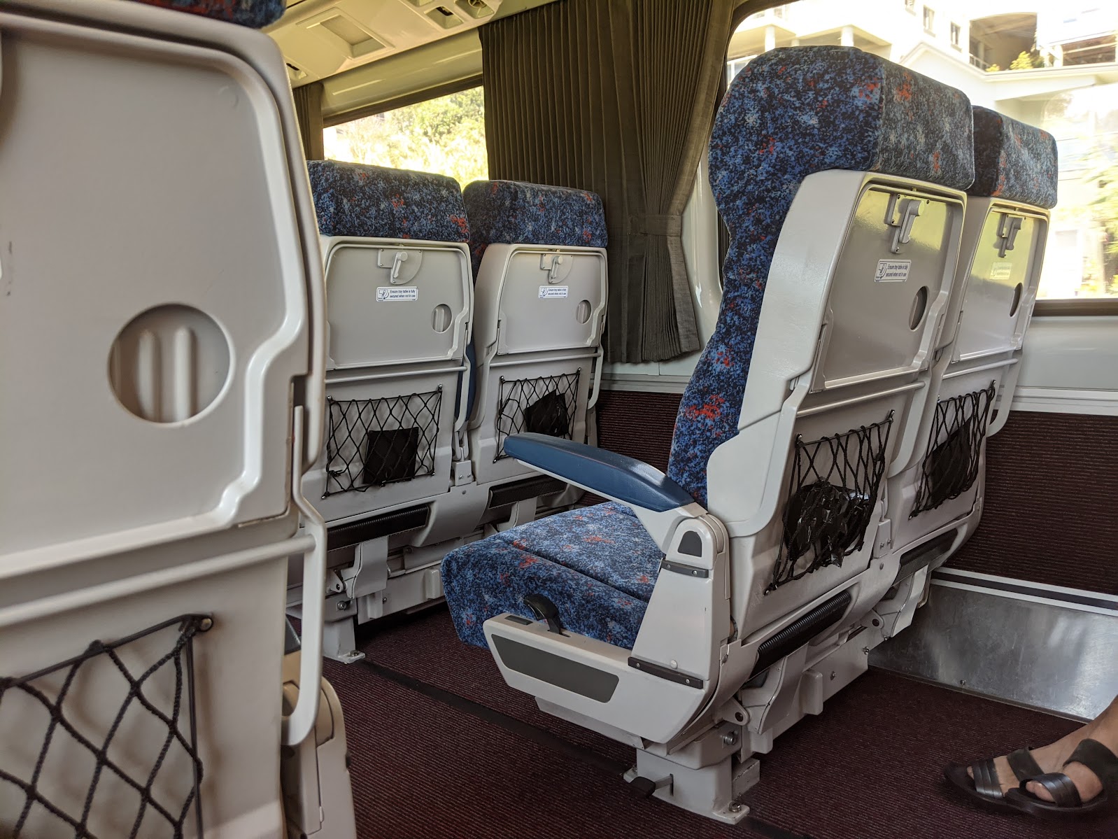 Economy seating with fold-down tray tables on the NSW TrainLink North Coast XPT from Coffs Harbour