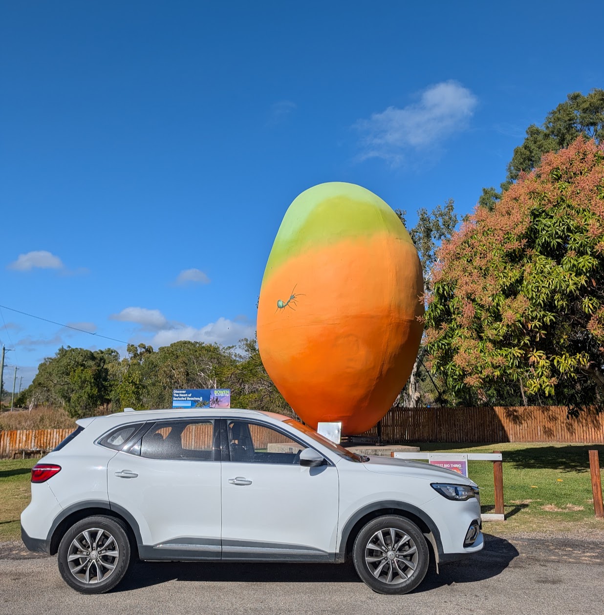 The MG relocation car parked in front of the Big Mango roadside attraction in Bowen, Queensland