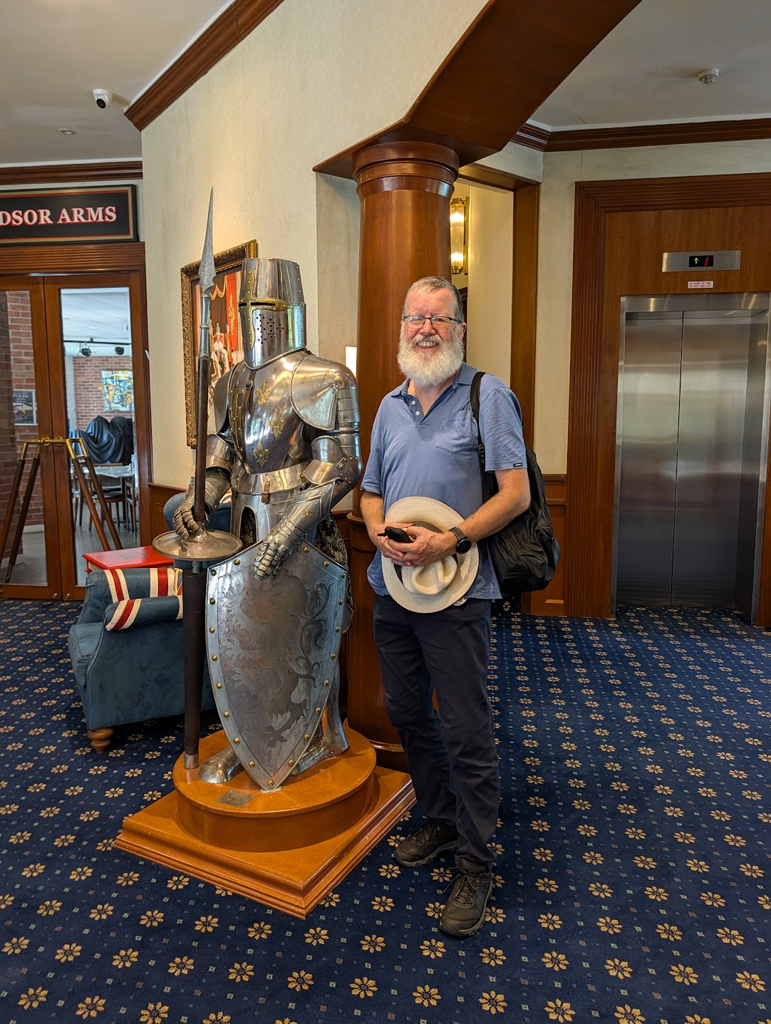 A full suit of armour in the lobby of the British Club, Singapore, beside the Windsor Arms bar