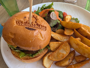 Burger and potato wedges with a side salad at the Wheelhouse restaurant, Tanglin Club, Singapore