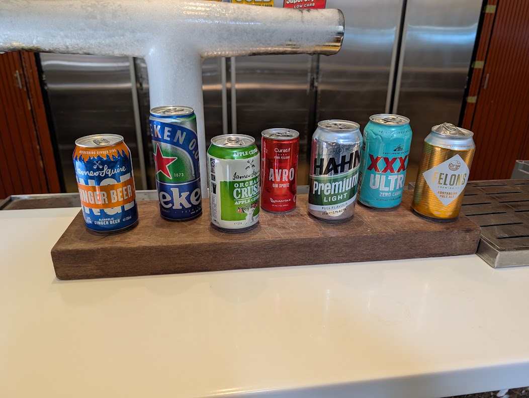 Drinks fridge at the Qantas Club Brisbane showing James Squire ginger beer, Heineken 0.0, cider, Qantas AVRO Gin Spritz, Hahn Premium Light, XXXX Ultra and Felons Pale Ale