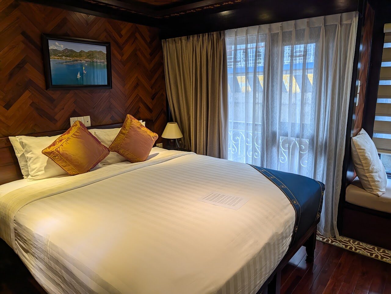Deluxe Upper Deck cabin on La Marguerite with a double bed and Juliet balcony doors