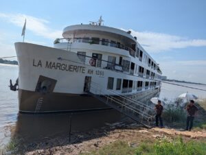 RV La Marguerite nosed into the Mekong riverbank with the gangway down for passengers