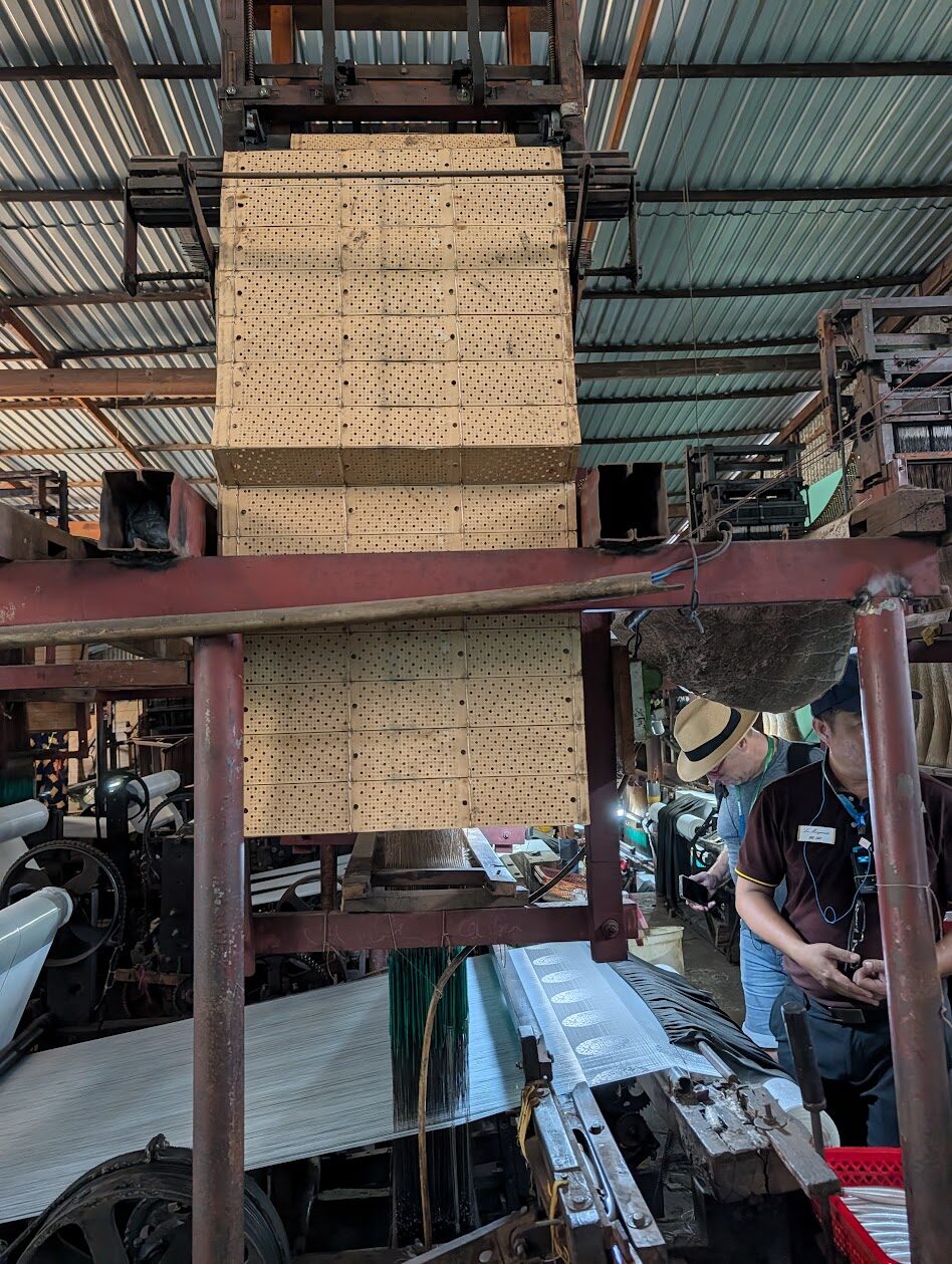 Silk loom driven by punch cards at a Mekong Delta weaving workshop